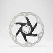 Bicycle disc brake rotor on a white background