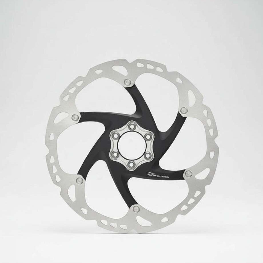 Bicycle disc brake rotor on a white background